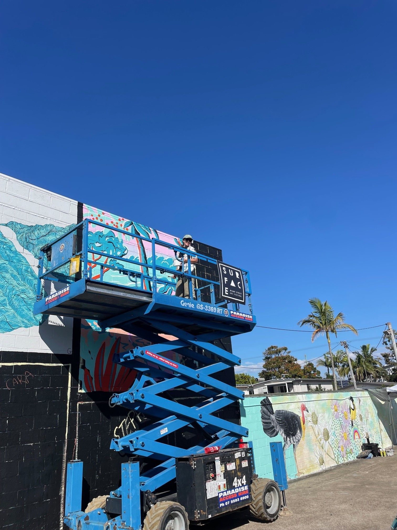 A blue scissor lift rentals gold coast