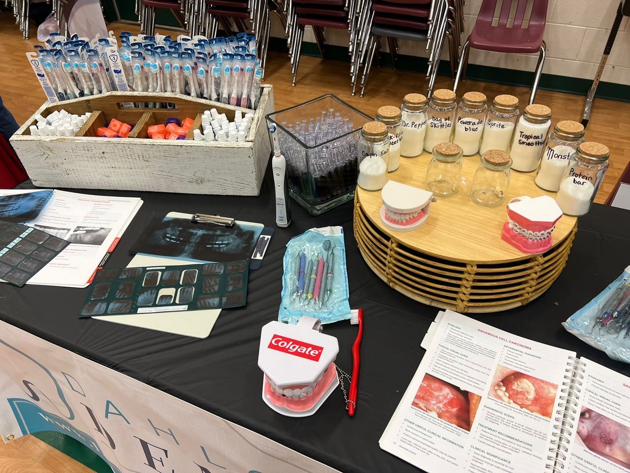 A table with toothbrushes and toothpaste on it