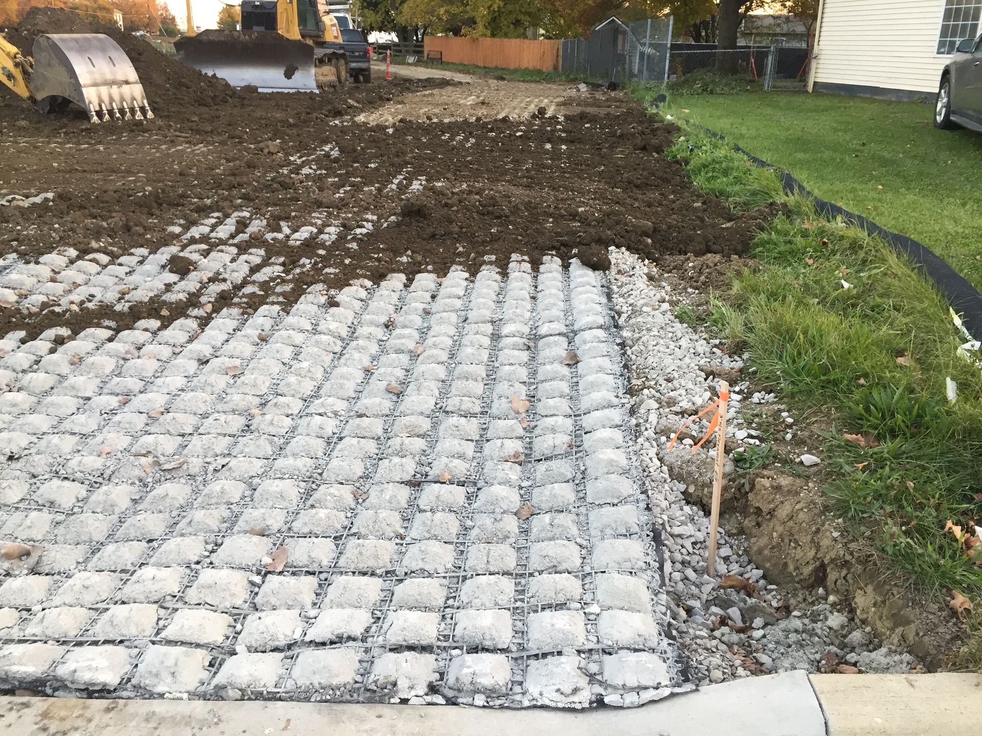 Covering the concrete pad with dirt