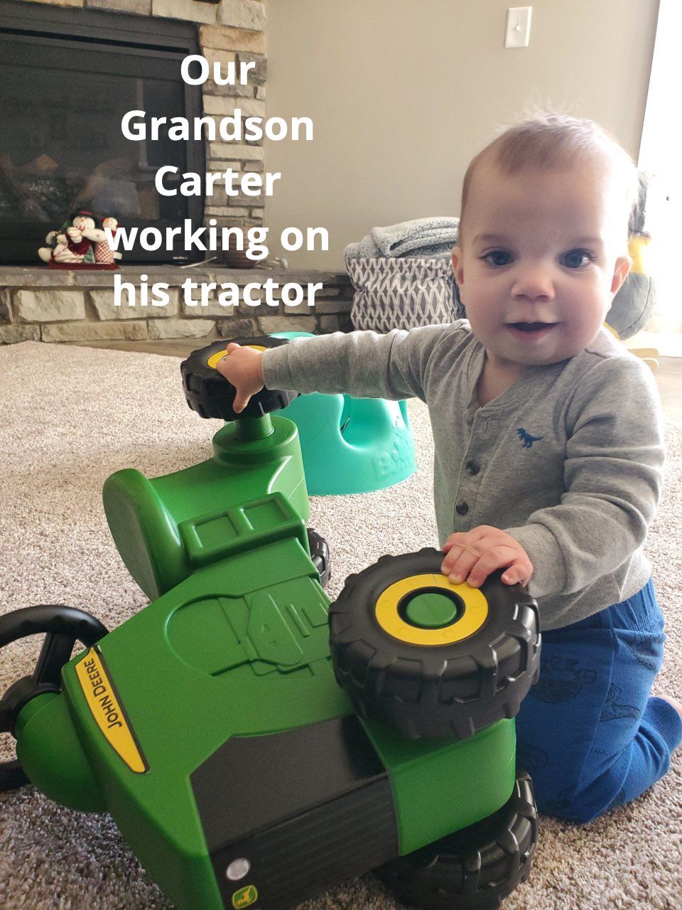 Grandson Carter working on his tractor