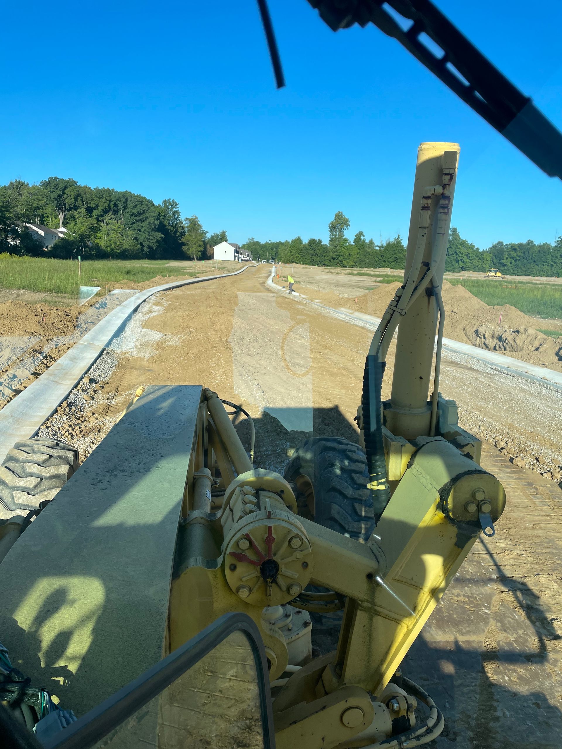 Putting the finishing grade on with the grader 