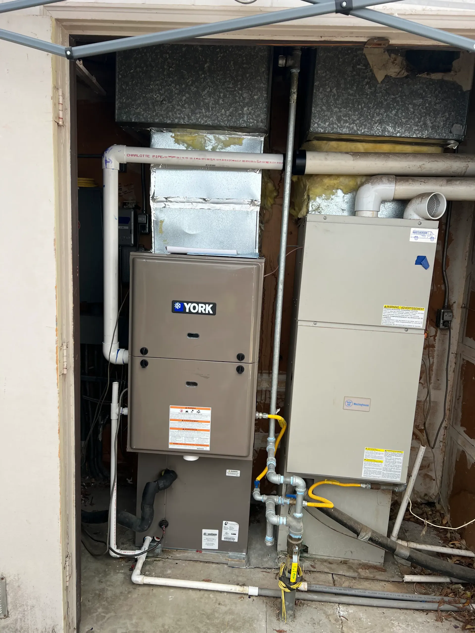 A york heating and cooling system is installed in a garage.