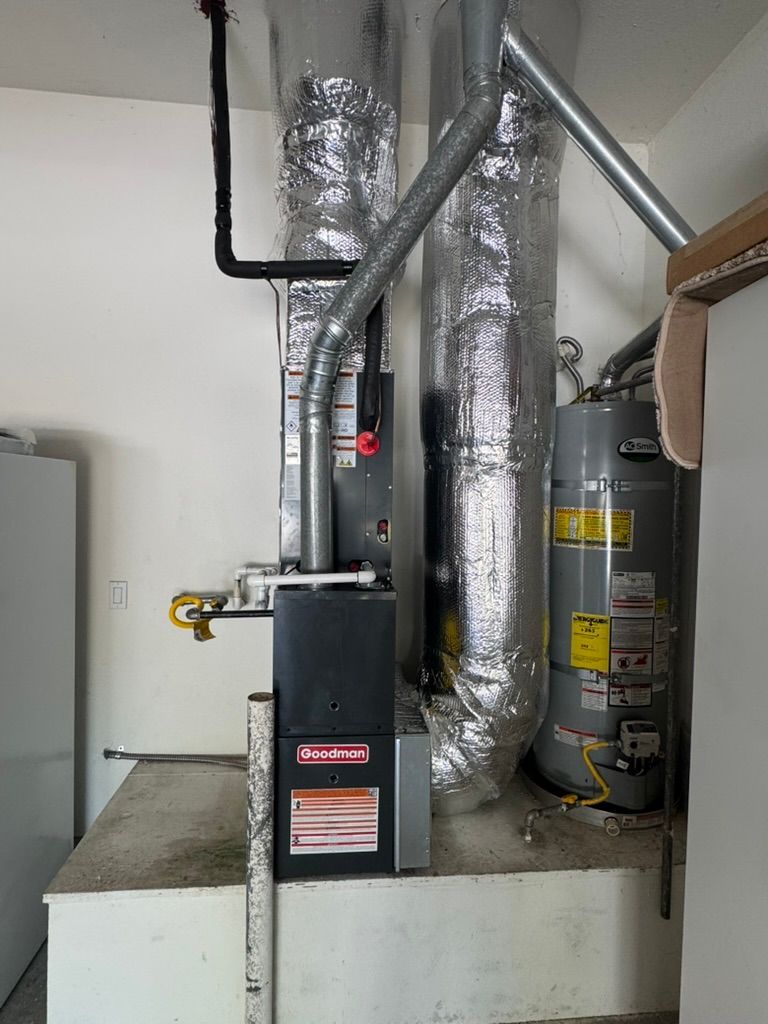 There is a heater and a water heater in the room.