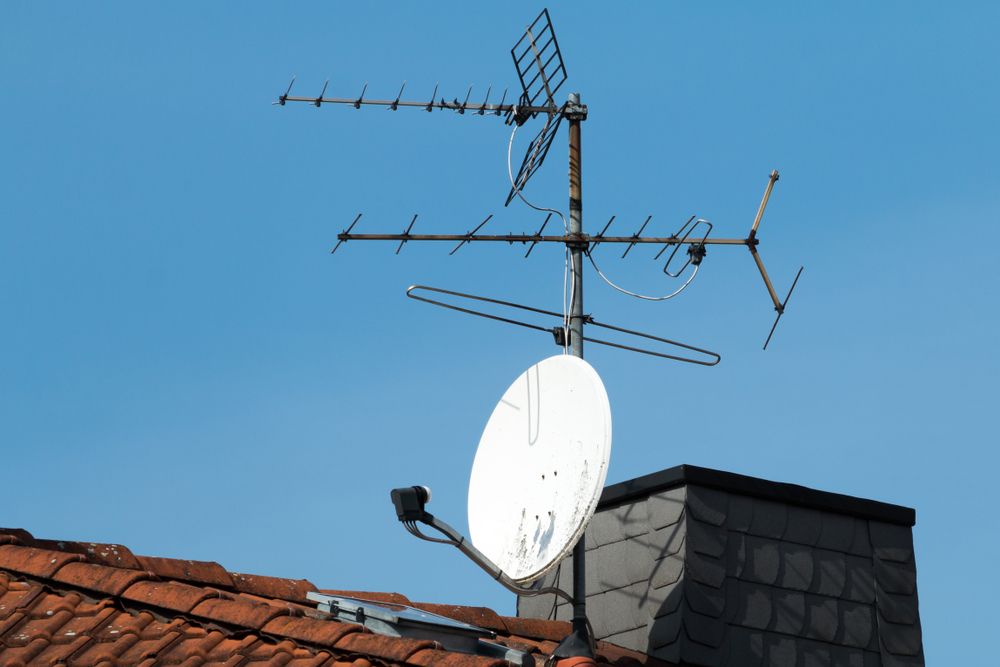 A Satellite Dish Is Mounted On The Roof Of A Building — Joytech In Ciccone, NT