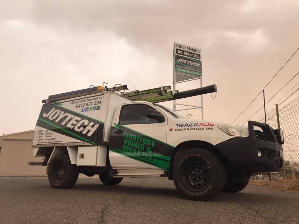 A Joytech Truck Is Parked On The Side Of The Road — Joytech In Ciccone, NT