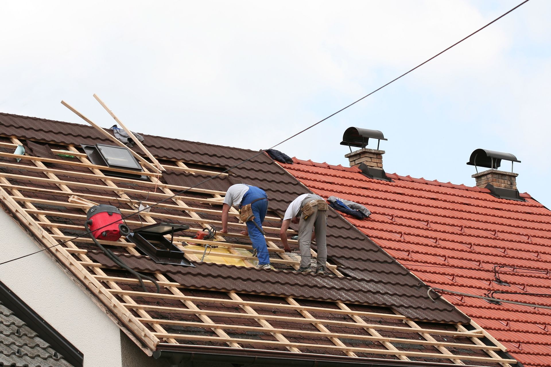 Men Fixing Roof
