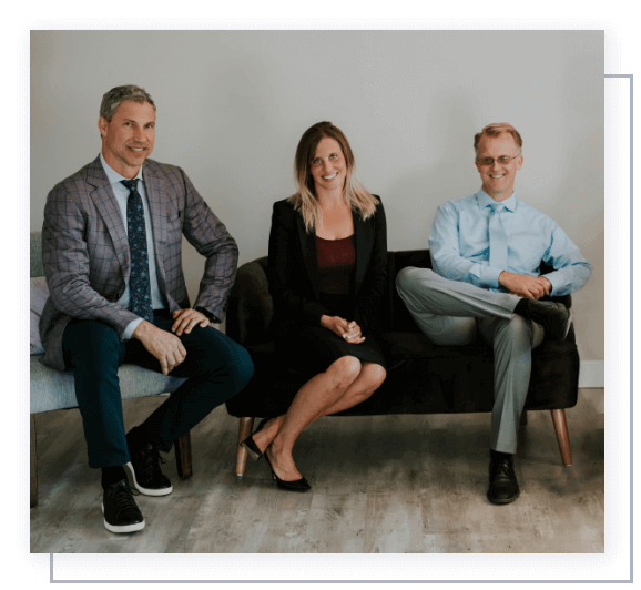 A close up of two people shaking hands in an office.