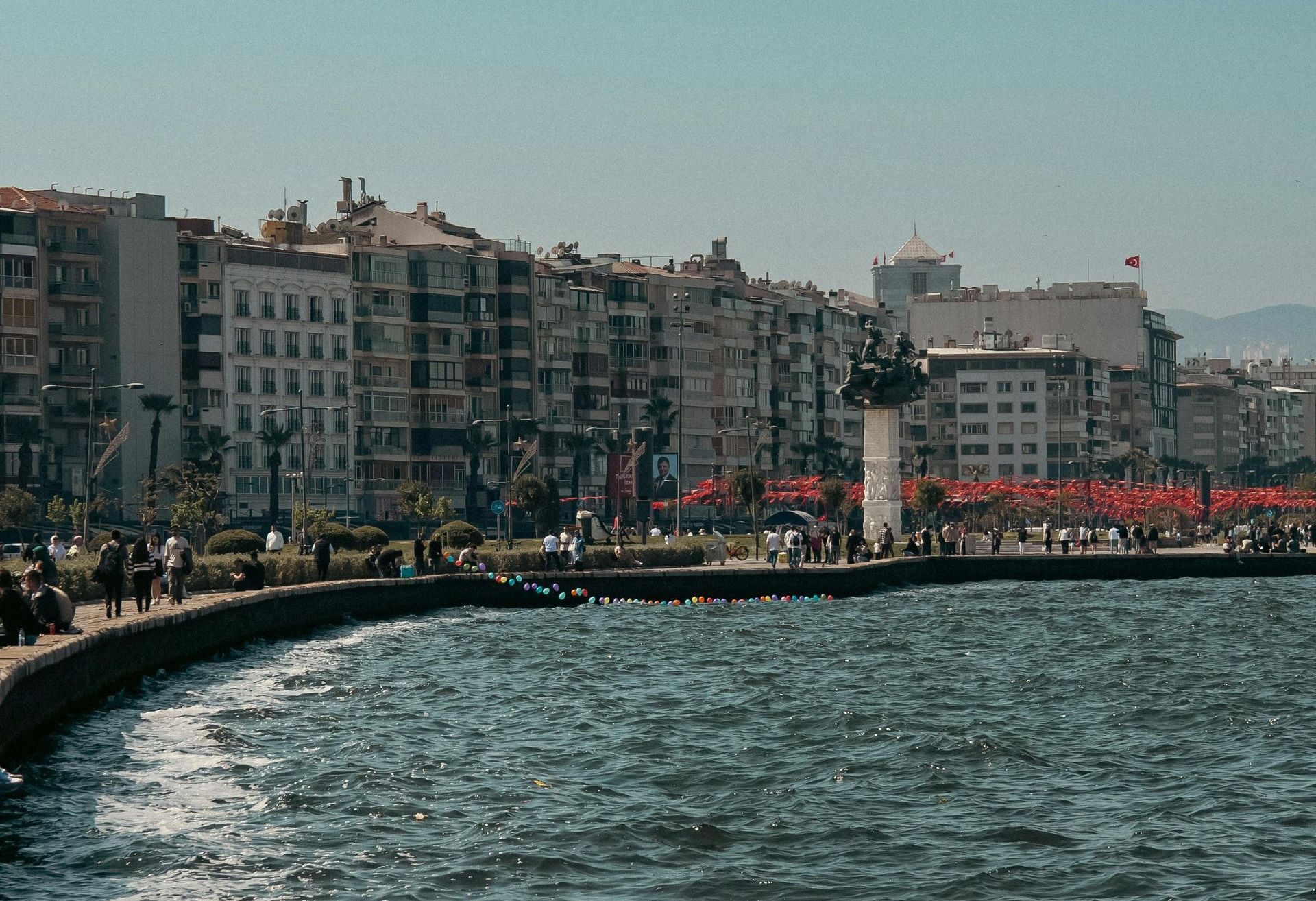 A sunny day along Izmir's Kordon, with a view of the coastline and waterfront promenade.