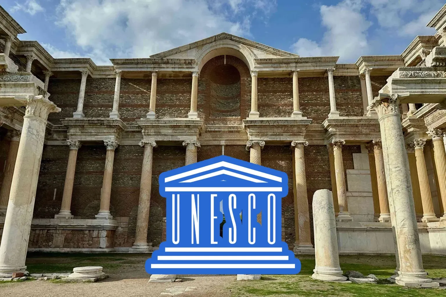 Ruins of an ancient building with UNESCO logo overlay