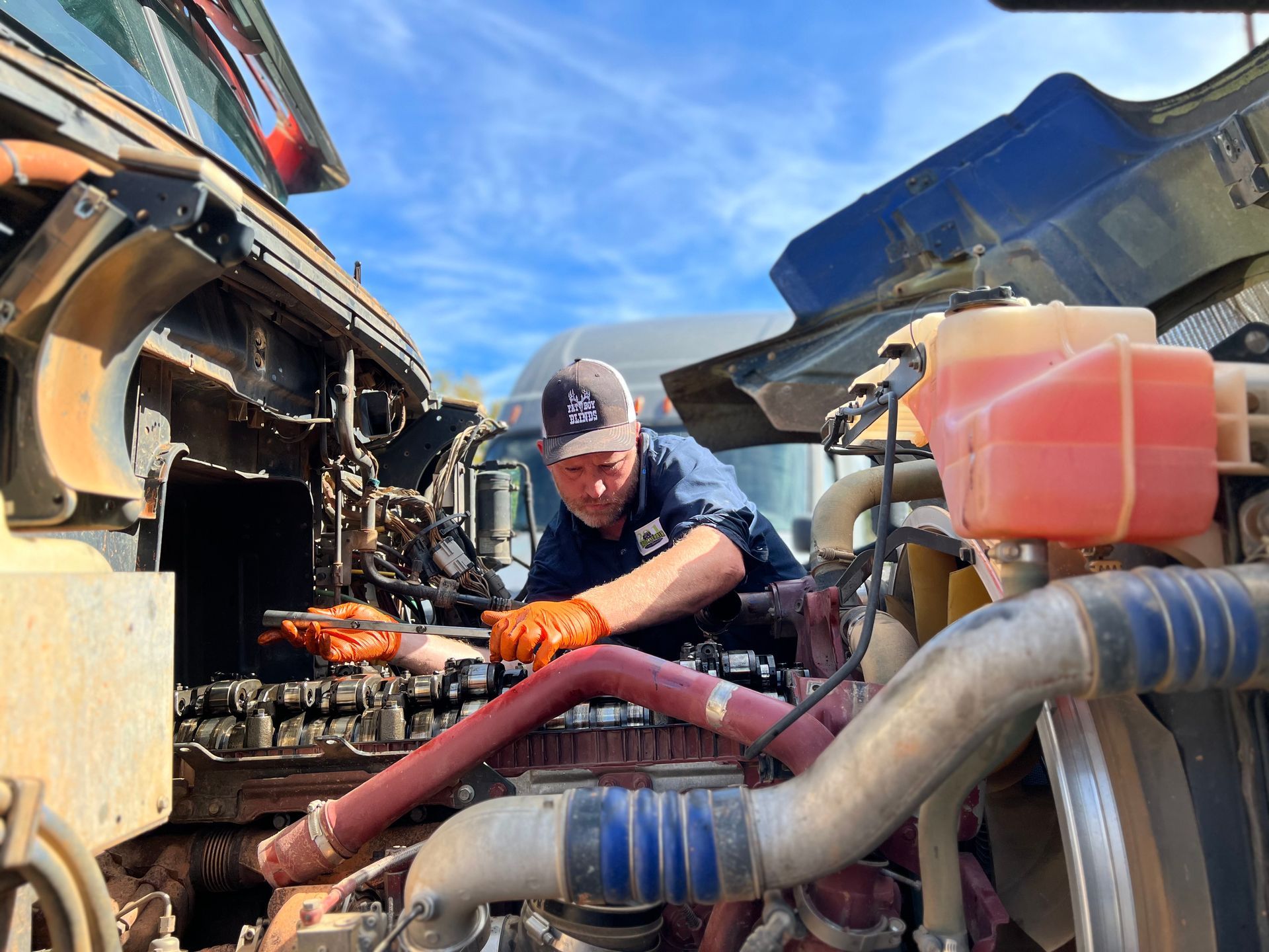 Daniel Owner 201 Truck Repair works on Semi Truck Engine