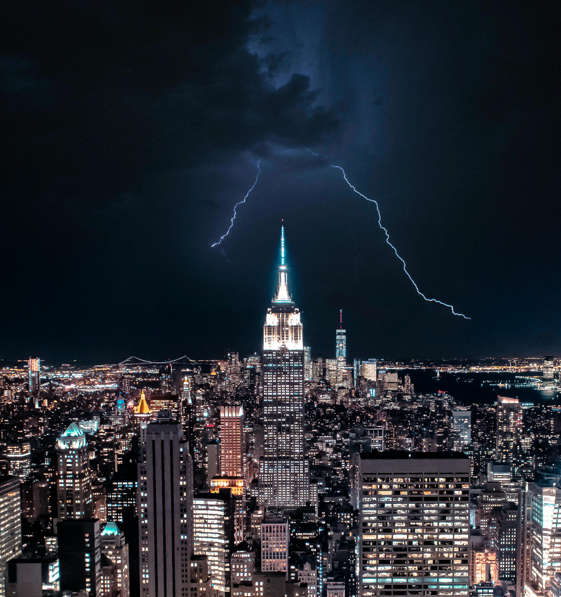 Lightning strikes over the empire state building at night