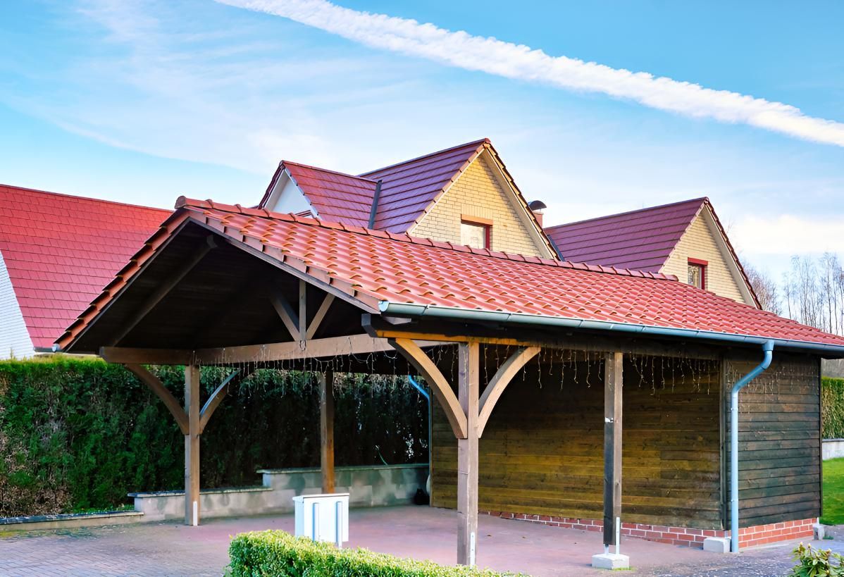 Wooden Carport With a Red Tiled Roof in Front of a House — Above All Roof Painters & Repairs in Narangba, QLD