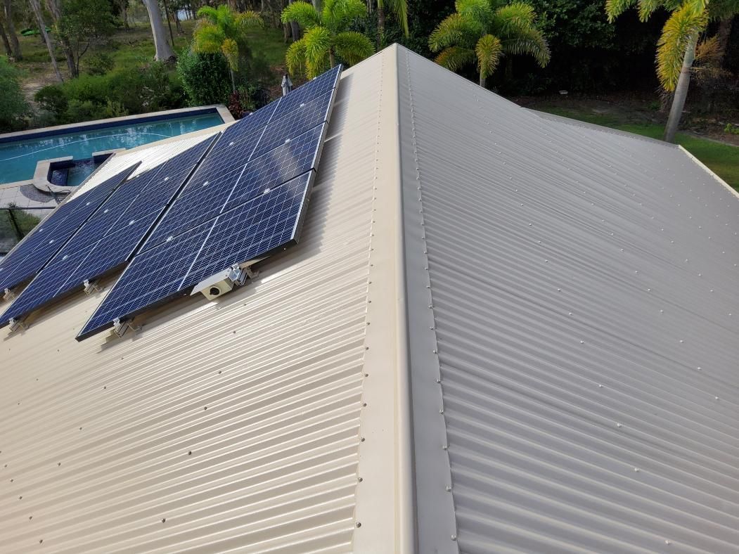 Roof With Solar Panels on It — Above All Roof Painters & Repairs in Bellmere, QLD