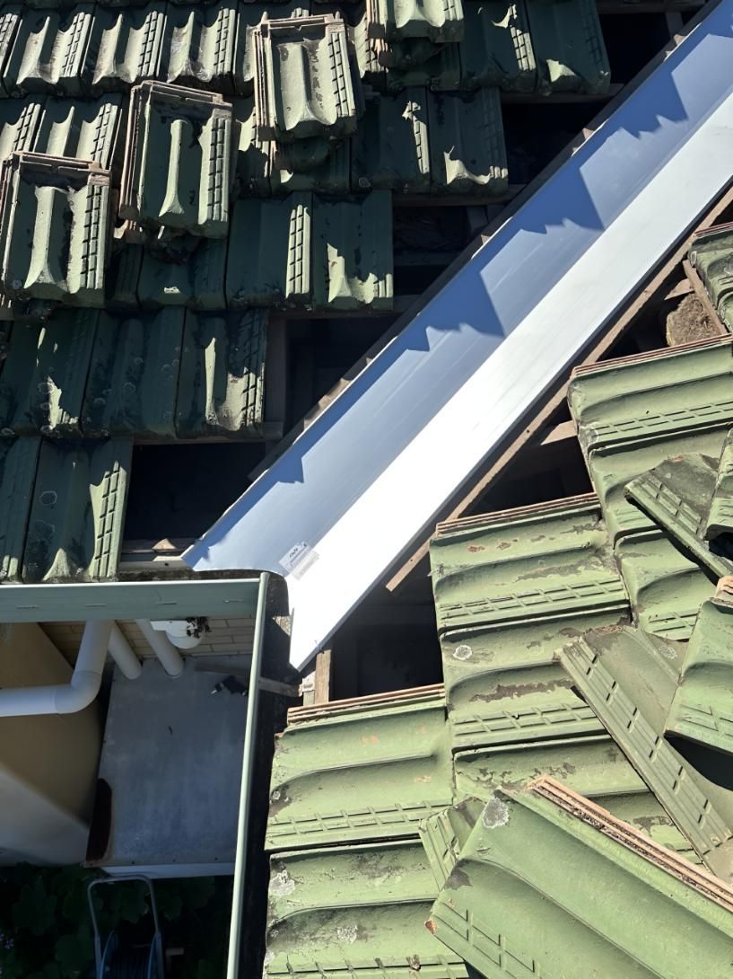 Roof With Green Tiles and a White Gutter — Above All Roof Painters & Repairs in Bellmere, QLD