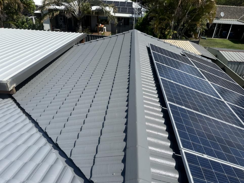 Roof With a Lot of Solar Panels on It — Above All Roof Painters & Repairs in Burpengary, QLD