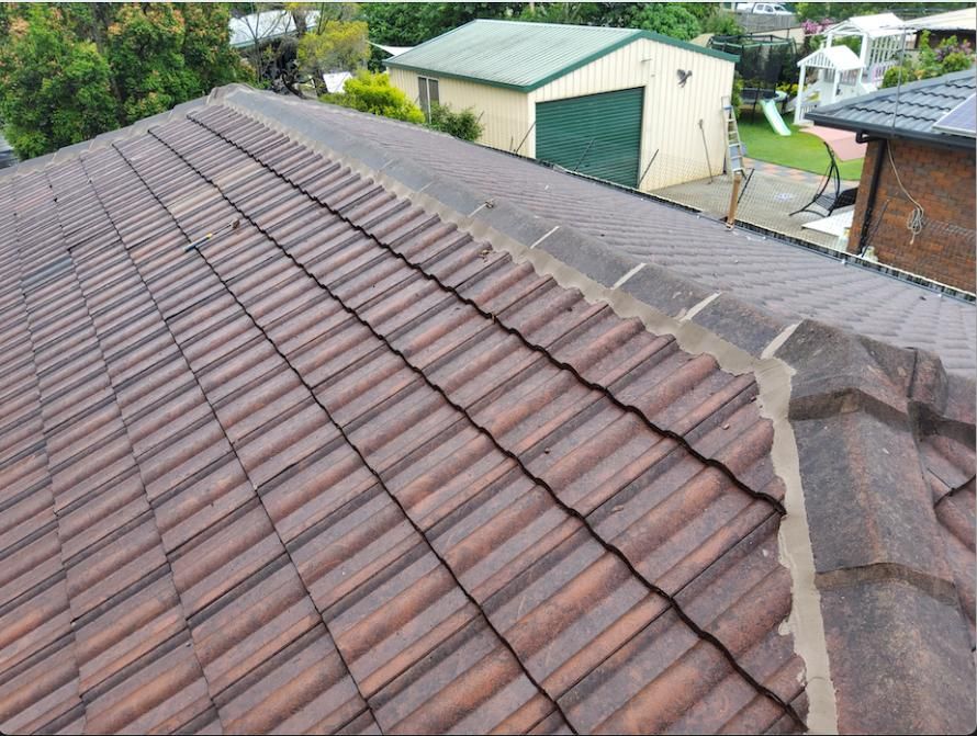 Brown Tiled Roof With a Green Garage — Above All Roof Painters & Repairs in Bellmere, QLD