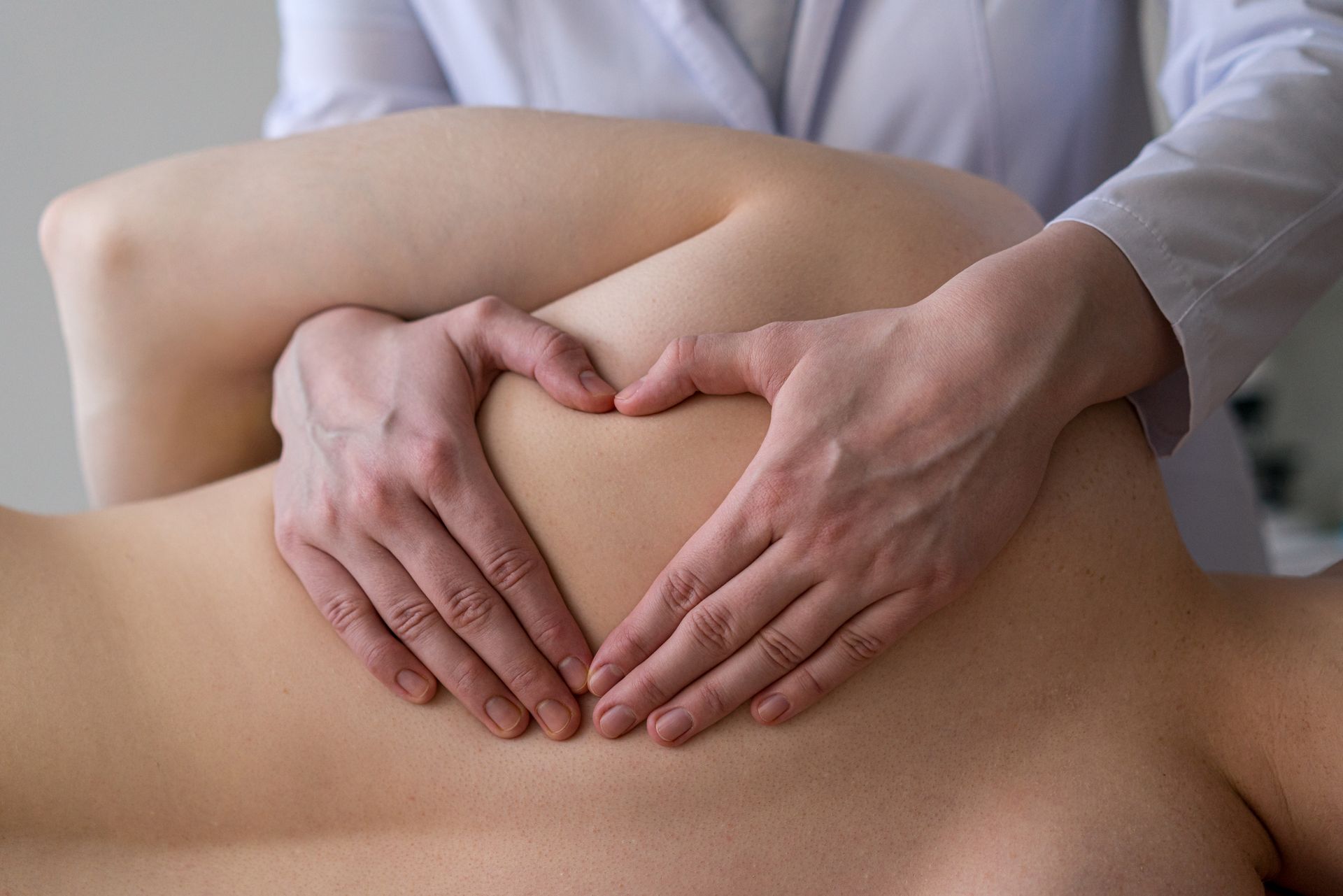 Man is getting a massage from a Doctor - Terre Haute, IN - Advanced Chiropractic Center