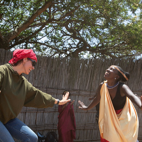 Visitor participating in traditional dance performance at Nyanza King's Palace