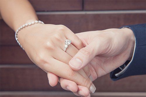 Holding Womans Hand With Diamond Ring