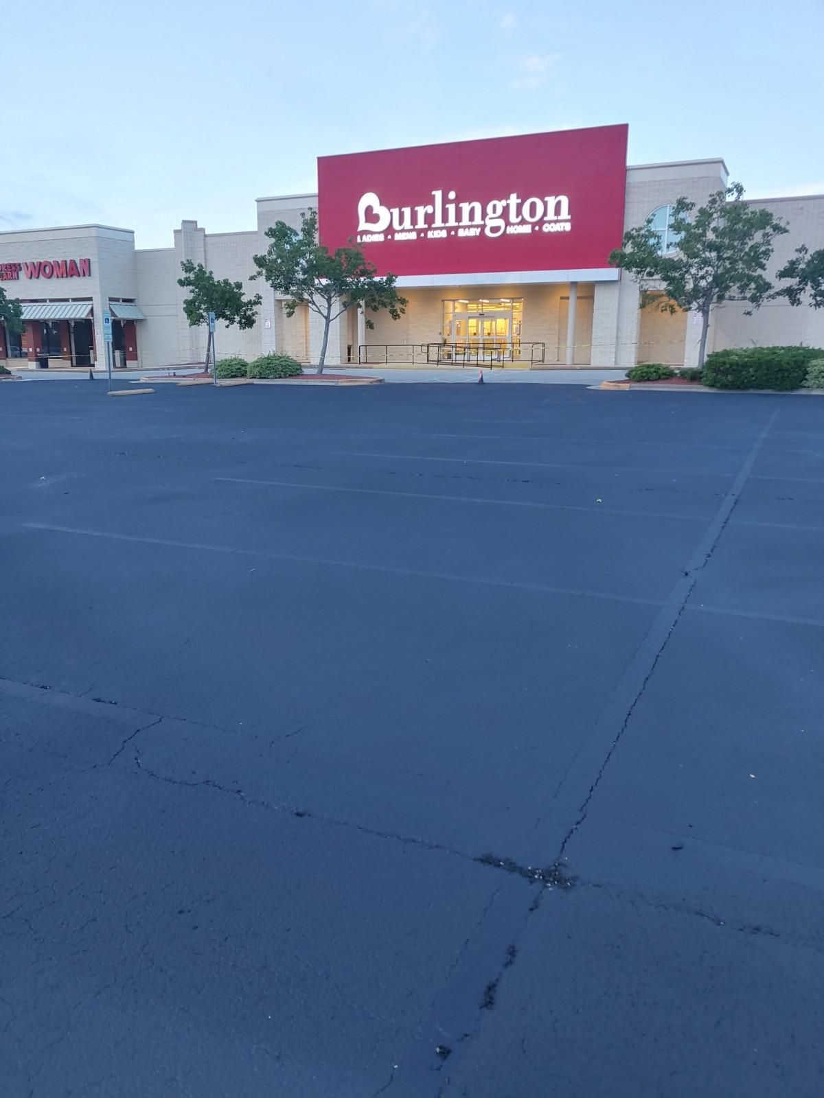 Burlington store with a large red sign and empty parking lot.