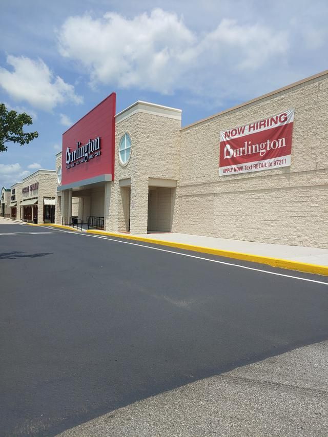 Burlington store exterior with a red and white sign on a sunny day. A