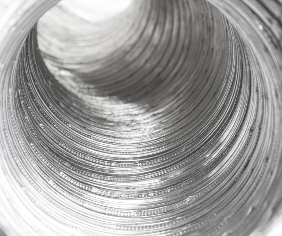 A close up of a metal pipe on a white background