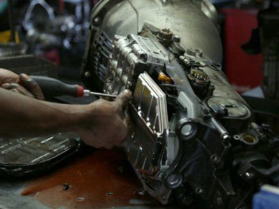 Transmission — Mechanic Repairing Car Transmission in Rochester, MN