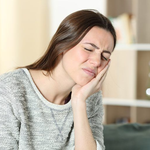 Woman with jaw pain looking for TMJ treatment