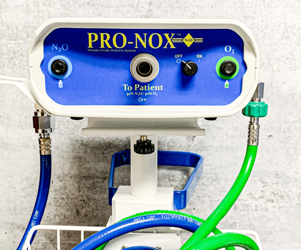 Pro-Nox machine: blue and white device dispensing a mix of nitrous oxide and oxygen to patients.