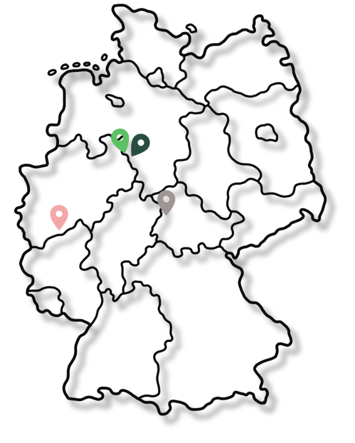 Karte von Deutschland mit farbigen Stecknadeln, die Städte markieren.
