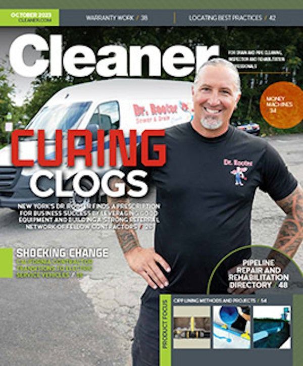 a woman is sitting on a bed using a laptop computer .