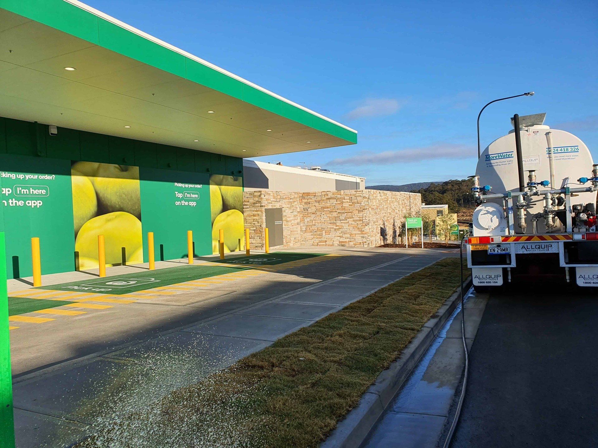 Water Truck Beside Supermarket