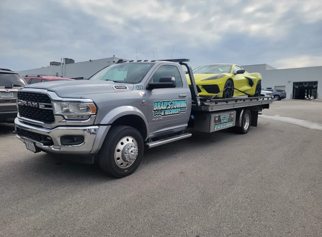The back of a tow truck with the words brad 's towing on it.