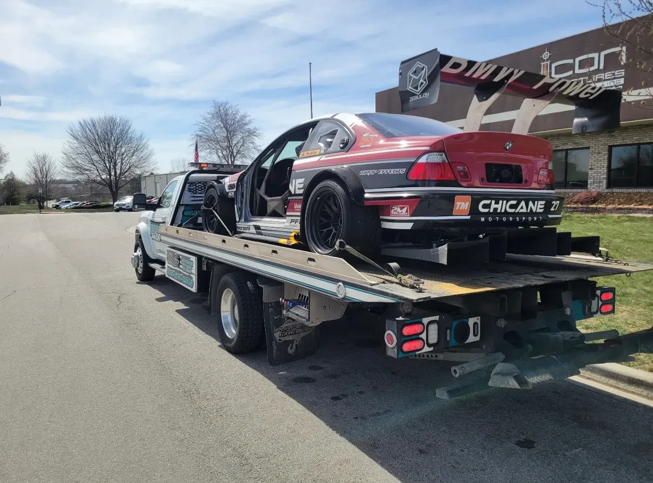 The back of a tow truck with the words brad 's towing on it.