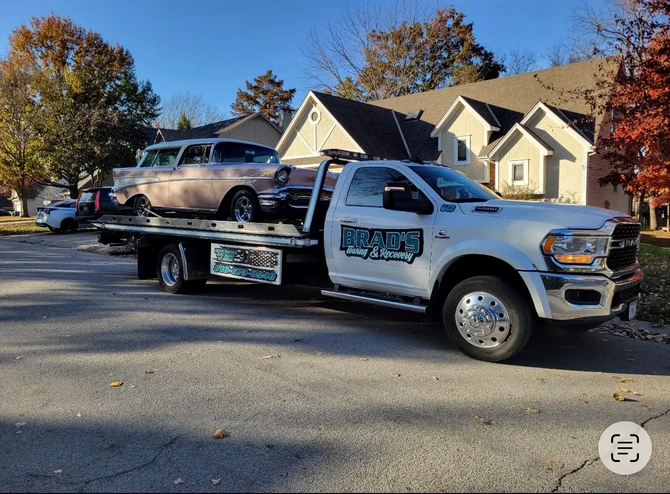 The back of a tow truck with the words brad 's towing on it.