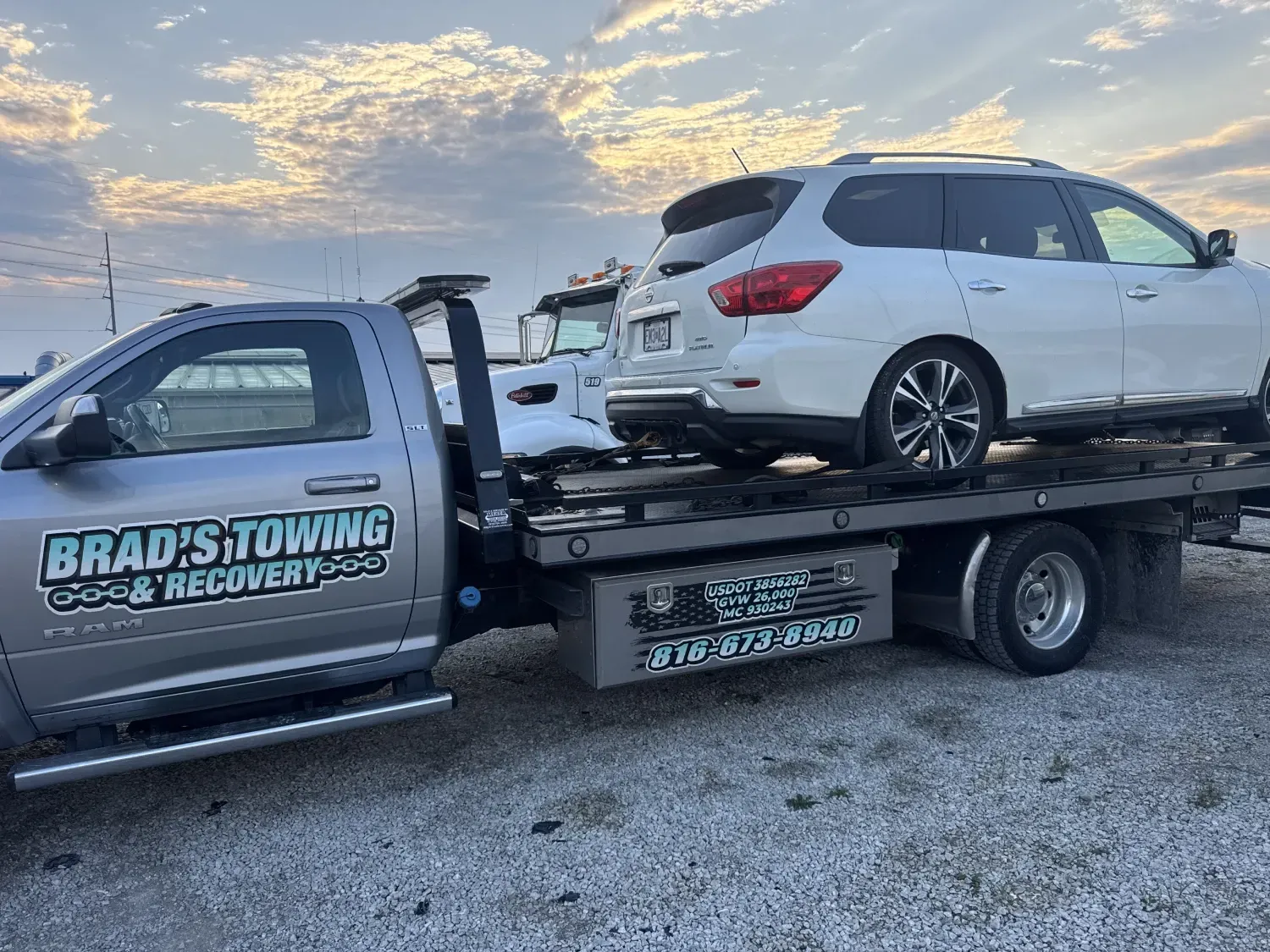 The back of a tow truck with the words brad 's towing on it.
