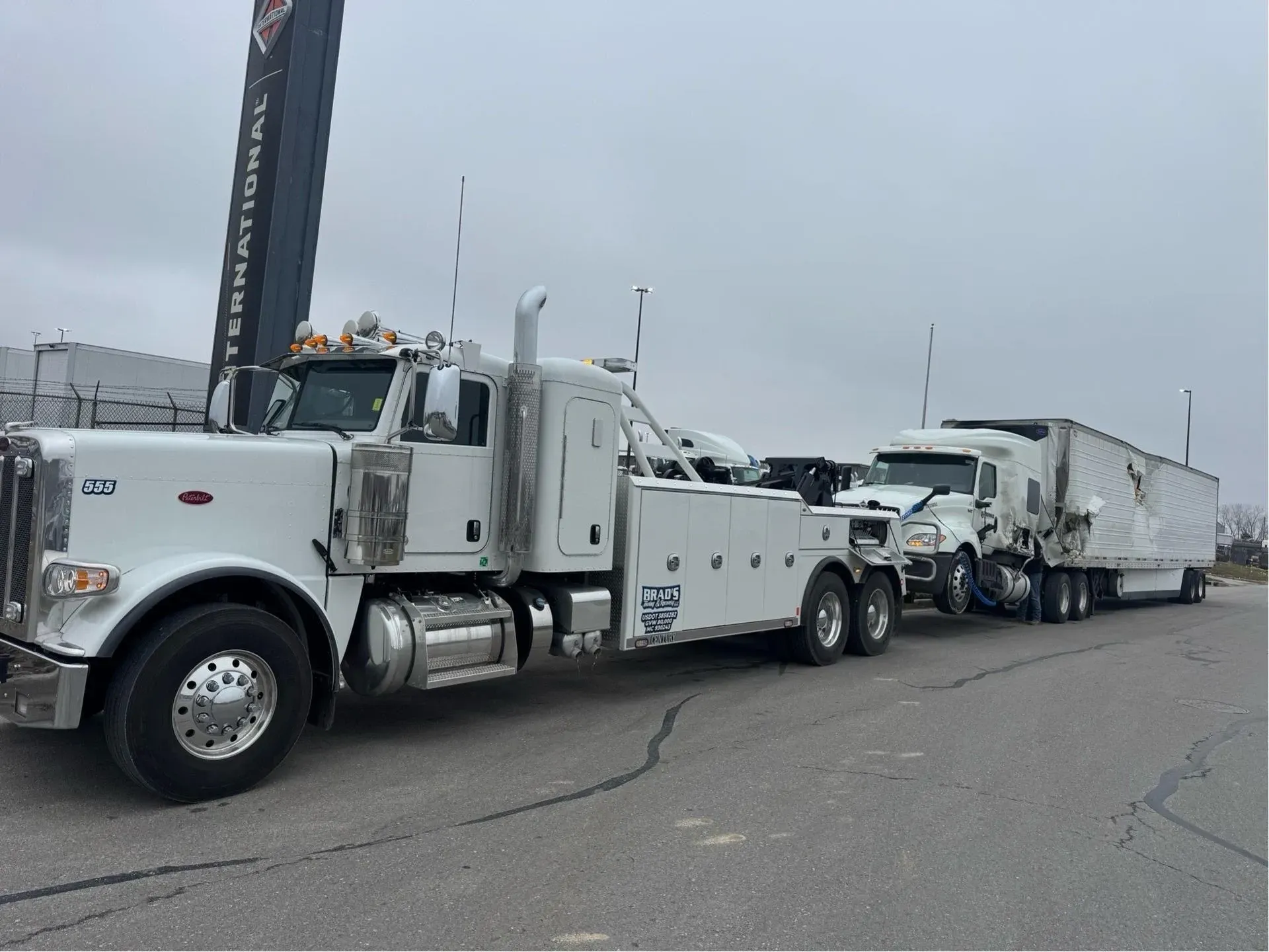 The back of a tow truck with the words brad 's towing on it.