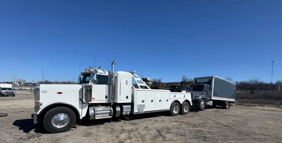 The back of a tow truck with the words brad 's towing on it.