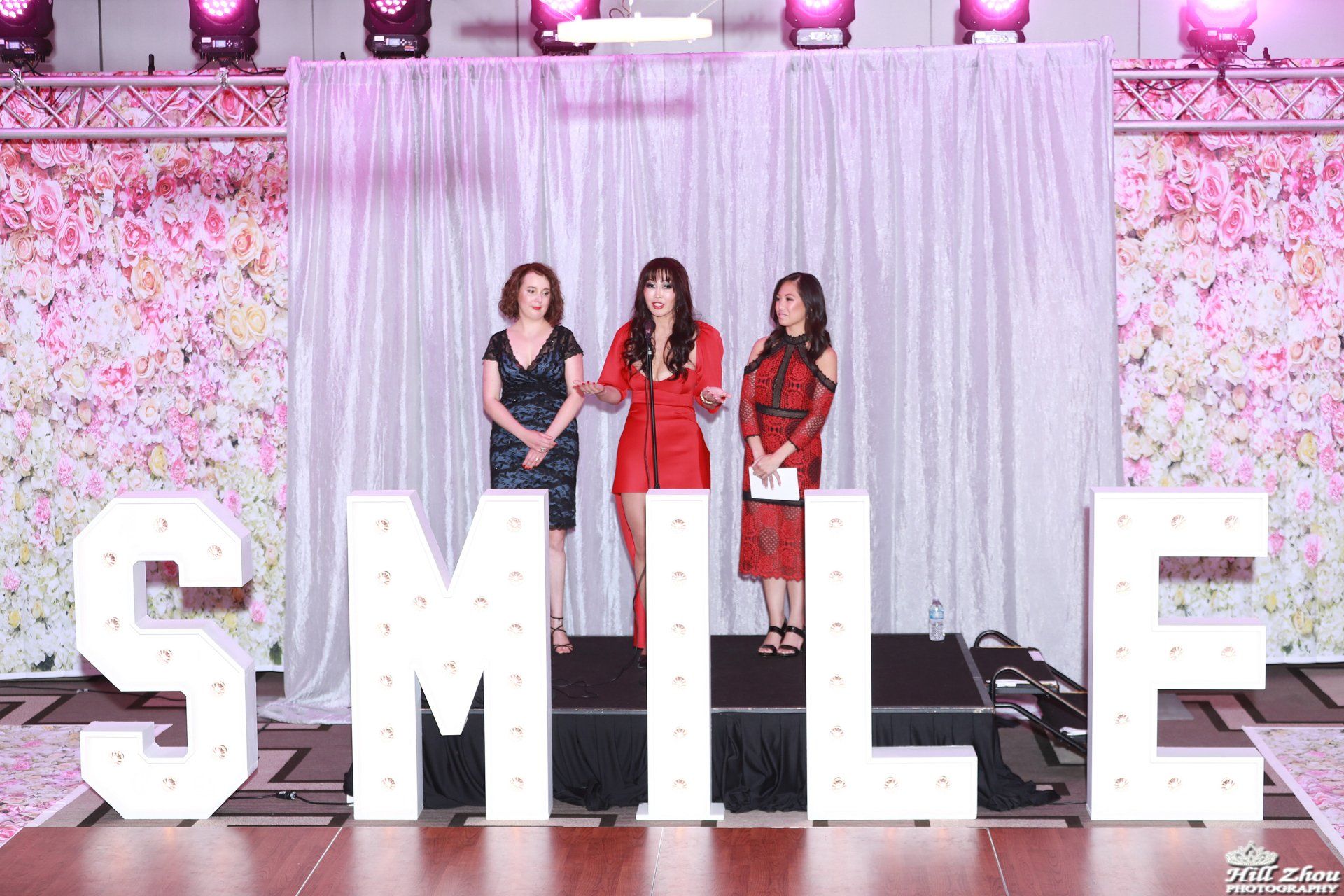 Women on stage of Project Smile event