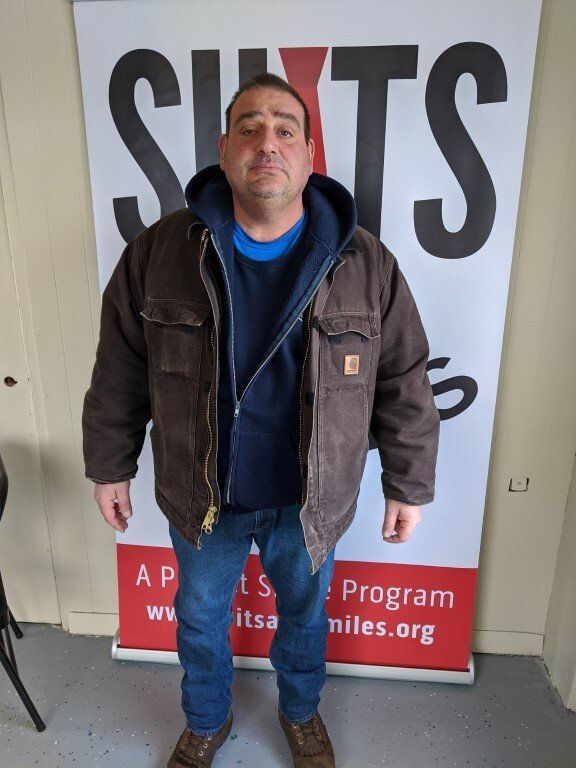 Man before suit donation