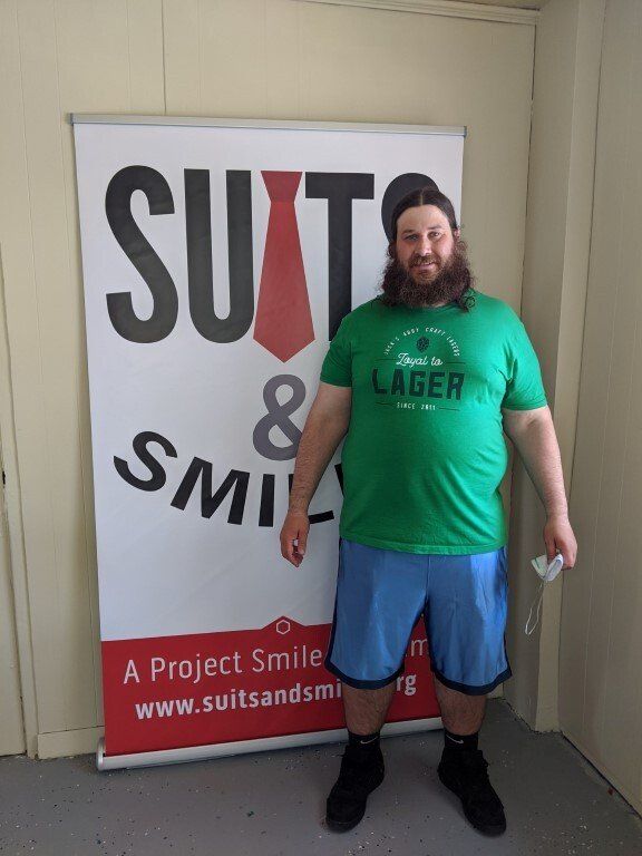 Man before suit donation