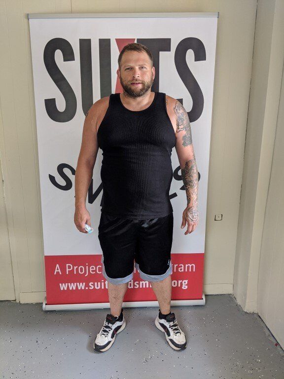 Man before suit donation