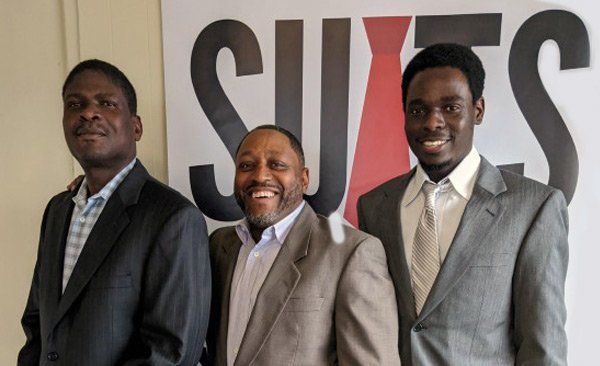 Men wearing donated suits