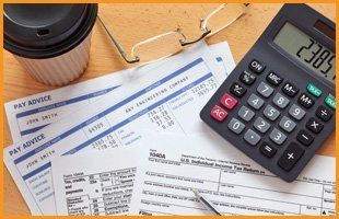 For accounting and bookkeeping in Liverpool, call Bibby & Co Accountants on 0151 284 6189 Papers, calculator, glasses and a cup of coffee on a desk