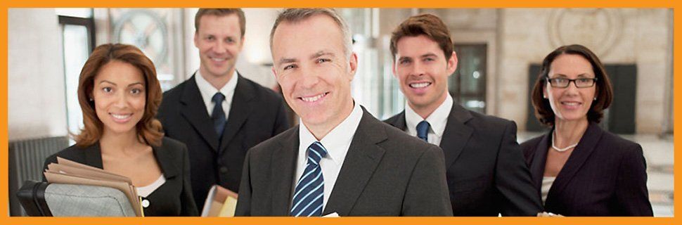 For accounting and bookkeeping in Liverpool, call Bibby & Co Accountants on 0151 284 6189 A group of professional looking people in suits