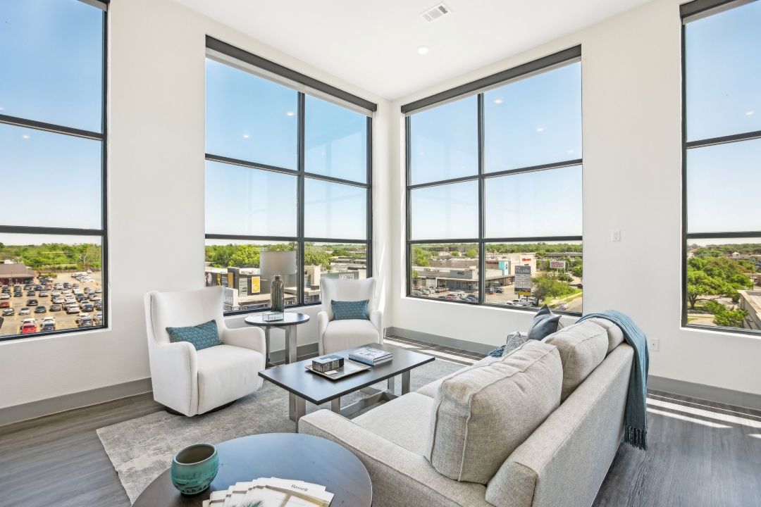 living room with white couches and view of Austin