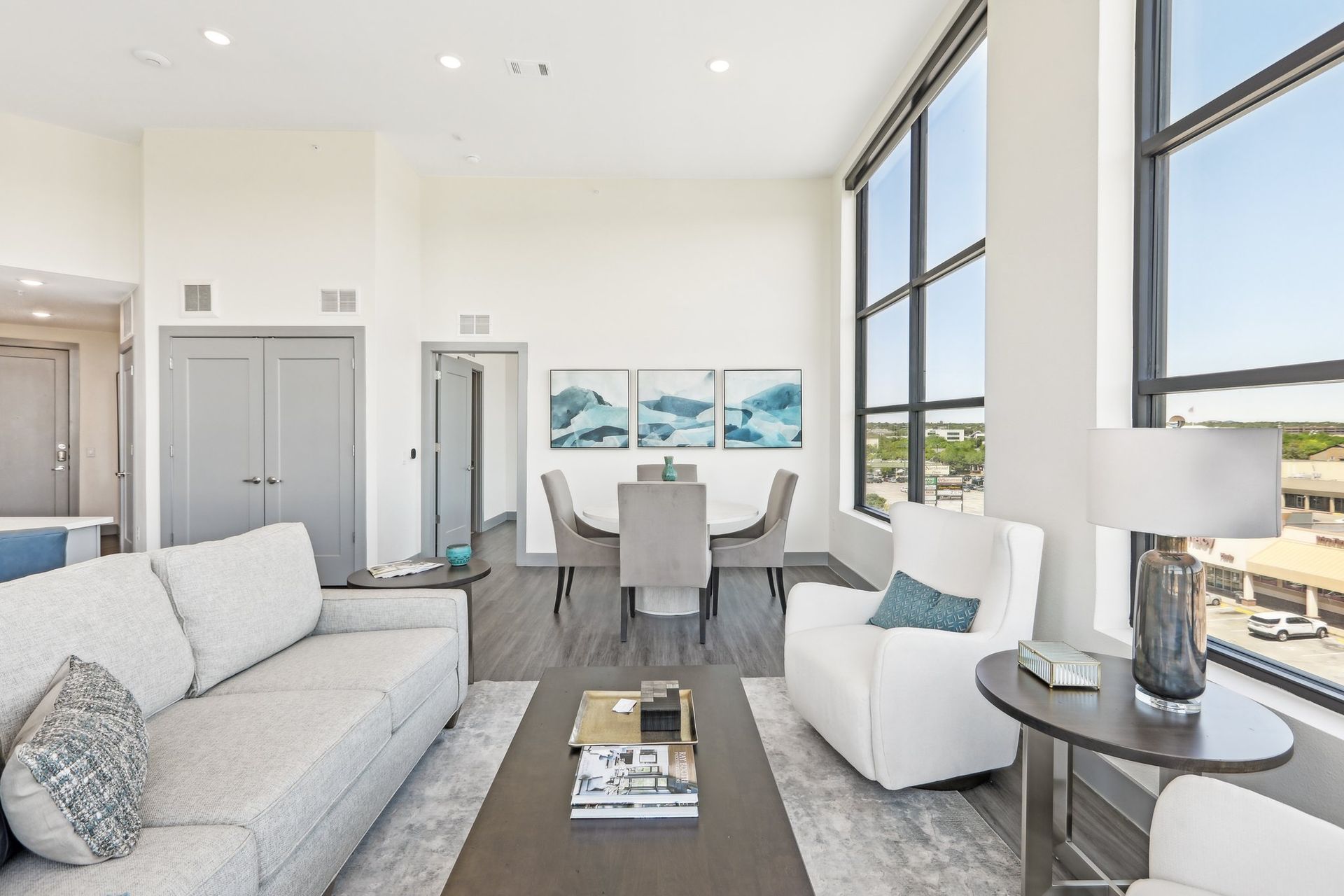 A living room with view of dining room