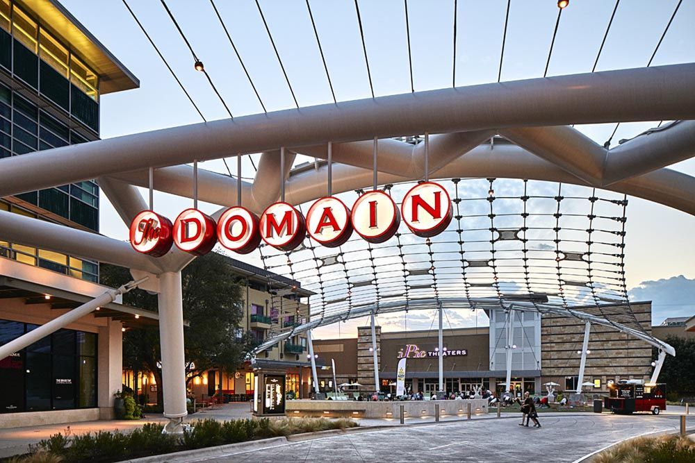 The Domain shopping center entrance arch with the word