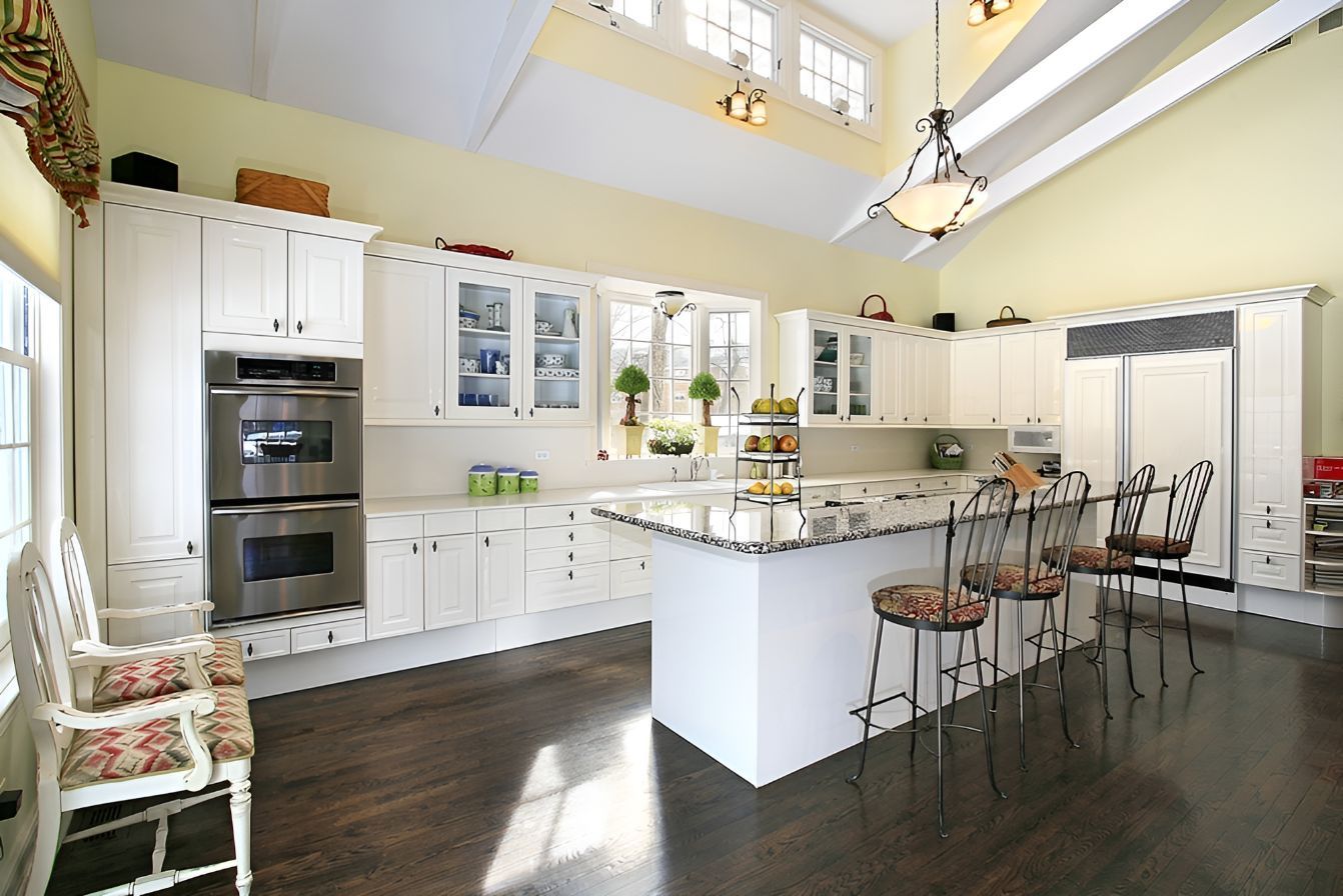 A Kitchen With White Cabinets and Stainless Steel Appliances — Foreshore Kitchens In Noosa, QLD