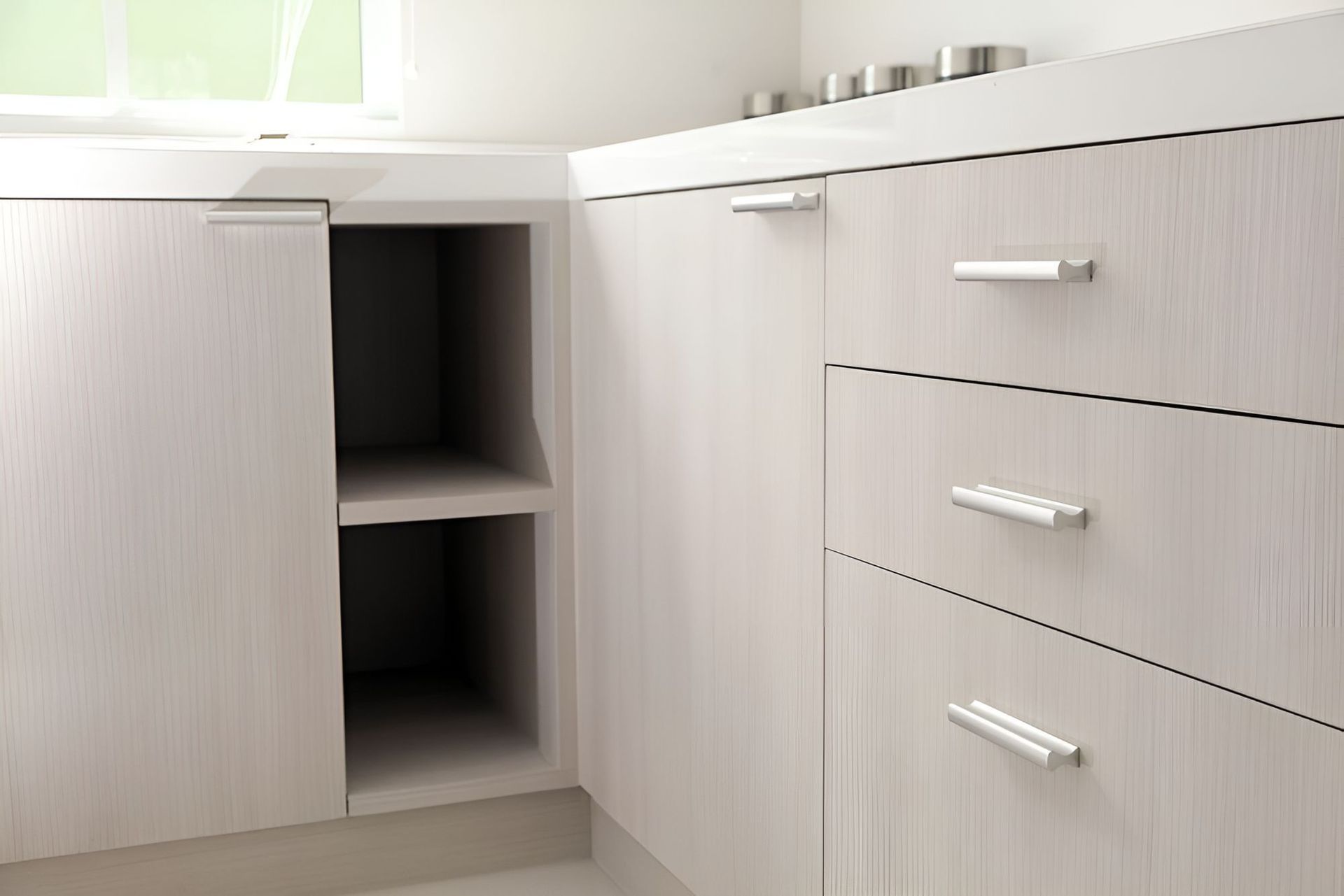 A Kitchen With White Cabinets and Drawers and a Sink — Foreshore Kitchens In Twin Waters, QLD